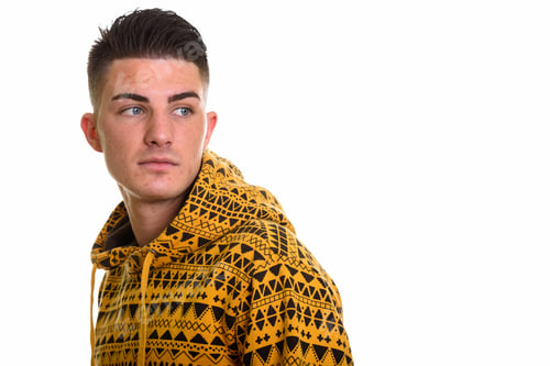 Preview: Studio shot of young handsome man looking back