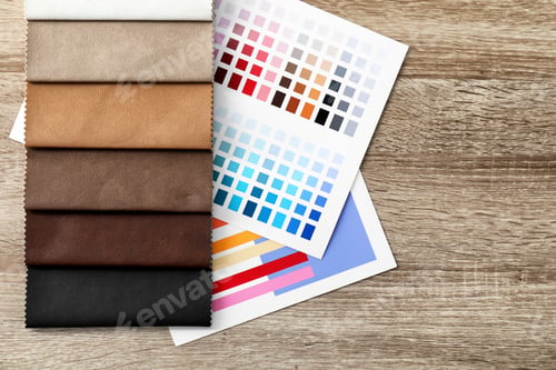 Preview: Upholstery fabric samples and color palette on table. Interior design