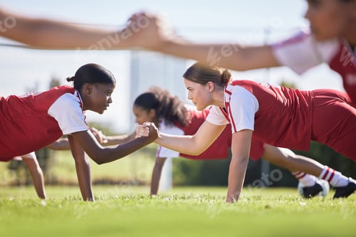 Preview: Women soccer, football or team sports holding hands in unity, support or motivation in routine work