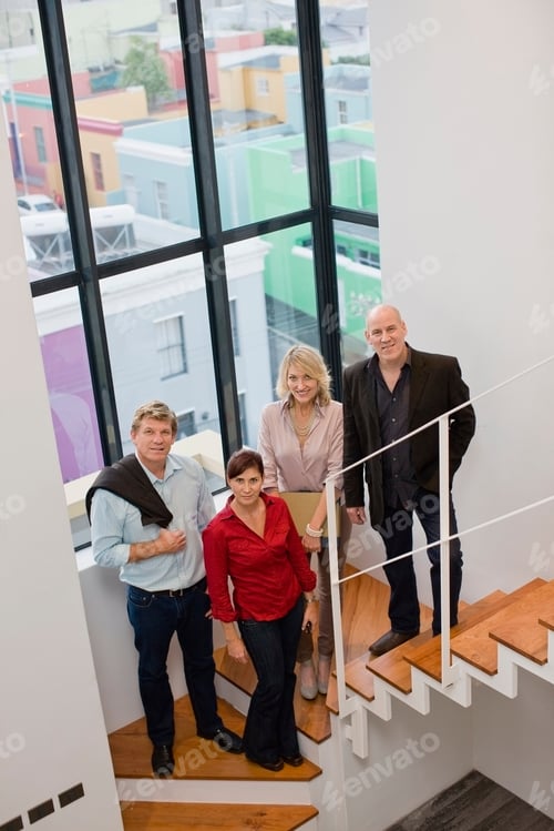 Preview: Business people smiling on stairs