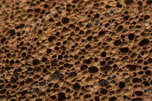 Preview: Closeup rock erosion holes sea wall.