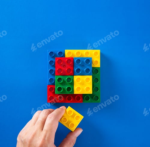 Preview: hand stacking up plastic block