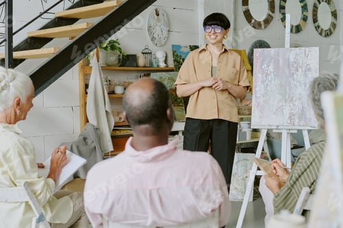 Preview: Young Adult Teacher Giving Drawing Lesson