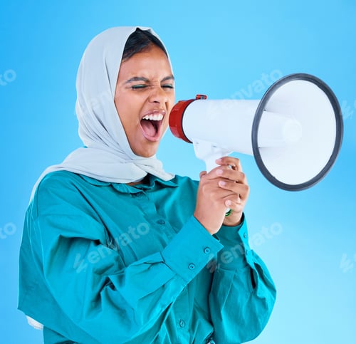 Preview: Young woman, muslim and megaphone in studio for protest, human rights and scream by blue background