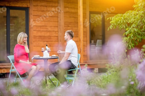 Preview: Couple during a dinner on the backyard of the house