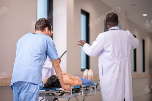 Preview: medic running with gurney along hospital corridor