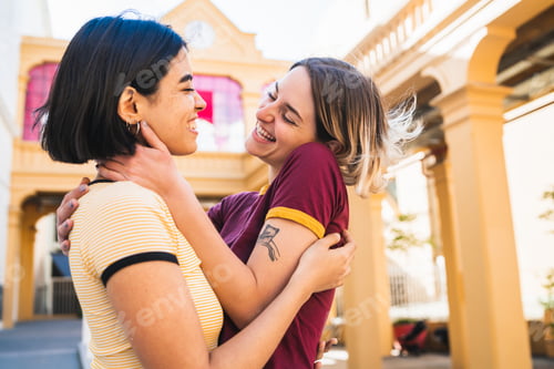 Preview: Loving lesbian couple at the street.