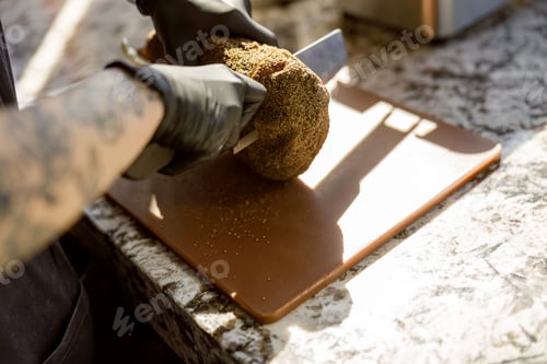 Preview: An skilled artisan is preparing fresh ingredients meticulously in a charming rustic kitchen