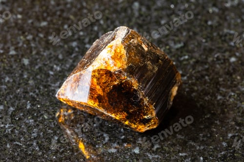 Preview: sample of rough dravite tourmaline rock on black