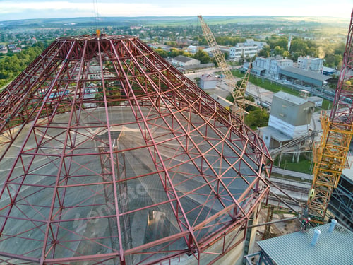 Preview: Aerial view of cement factory under construction with high concrete plant structure