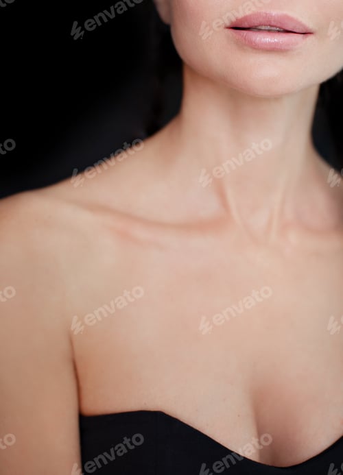 Preview: Beauty women lips nude makeup, beautiful neck and neckline, clean skin on black background