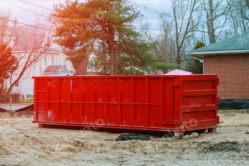 Preview: Loaded dumpster near a construction site, home renovation container for construction waste