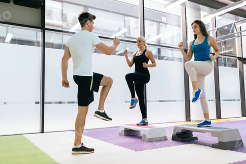Preview: Personal trainer exercising with trainees