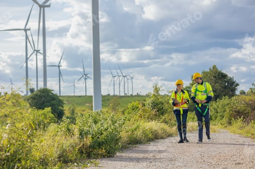 Preview: Engineers service team walking together working service maintenance wind turbine farm