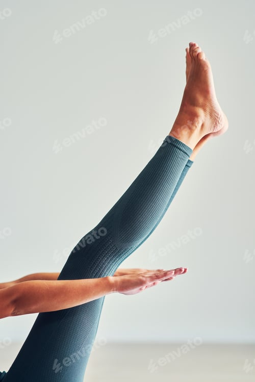 Preview: Adult woman practising yoga at home