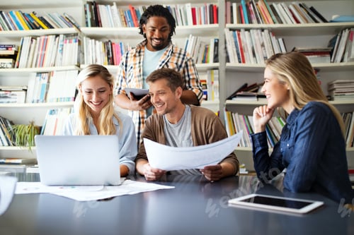 Preview: Group of business people and software developers working as a team in office