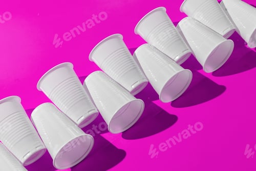Preview: abstract pattern of plastic cups on color surface with harsh trendy shadows