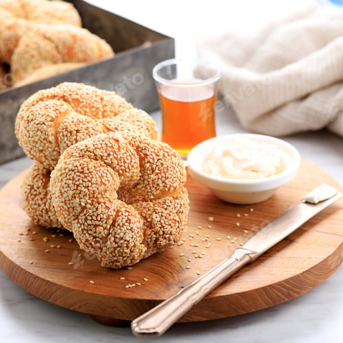 Preview: Traditional Turkish Bagel or Popular as Simit on White Table, Served with Turkish Tea
