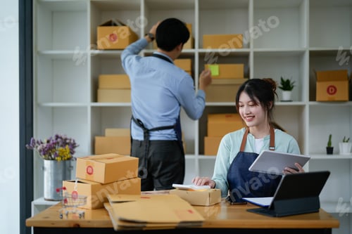 Preview: startup small business owner working with tablet at workplace. freelance man and woman seller check