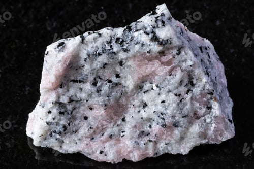 Preview: raw miaskite with pink cancrinite rock on black