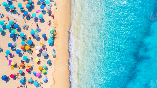 Preview: Beach, people and umbrellas. Top view from drone at the beach and azure sea.
