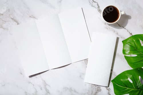 Preview: Mockup menu or brochure restaurant or coffee shop menu, coffee mug, plants on marble background. Cop
