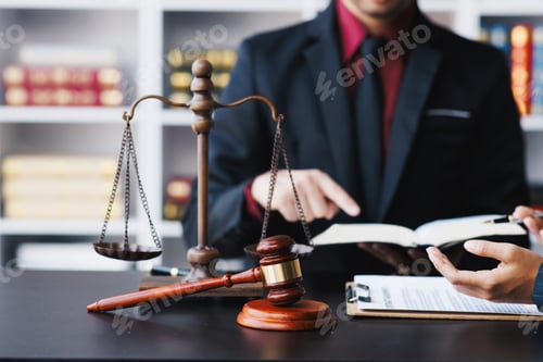 Preview: Lawyer working with client discussing contract papers with brass scale about legal legislation.
