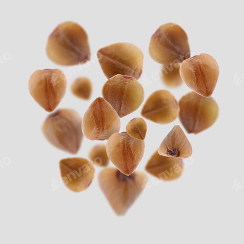 Preview: Buckwheat flying on grey background. Grains in air