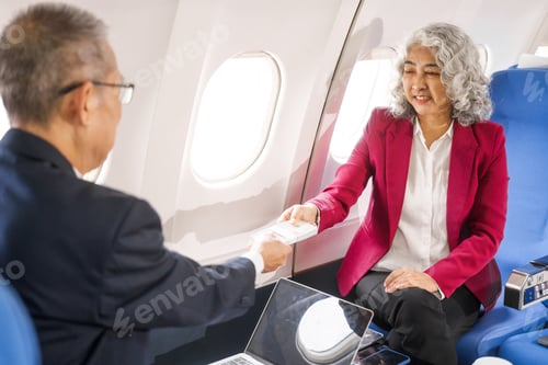 Preview: A businessman, an adult man, and a woman are meeting talking aboard an airplane. They hold hands,