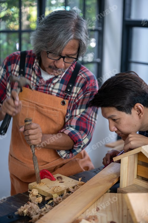 Preview: Carpenter working on woodworking machines in carpentry shop, wooden product