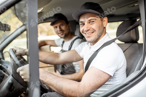 Preview: Delivery company employees driving a cargo vehicle