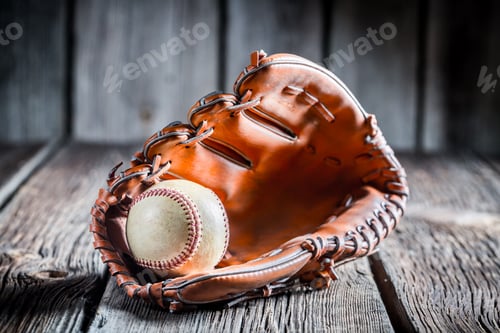 Preview: Age Baseball glove and ball on old wooden table