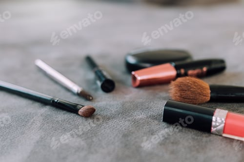 Preview: Makeup brushes and tools on desk.