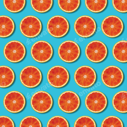 Preview: Red orange slices pattern on turquoise background, minimal flat lay top view food texture