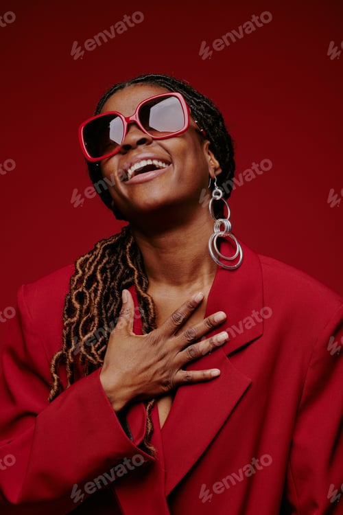 Preview: Laughing African American Woman Wearing Red Sunglasses