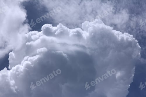 Preview: Summertime Clouds - Photograph Of Cumulus Clouds Growing In A Warm Summertime Sky.