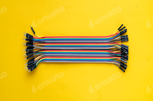 Preview: bunch of electronic wires or caples in colorful isolation on the table, connection concept