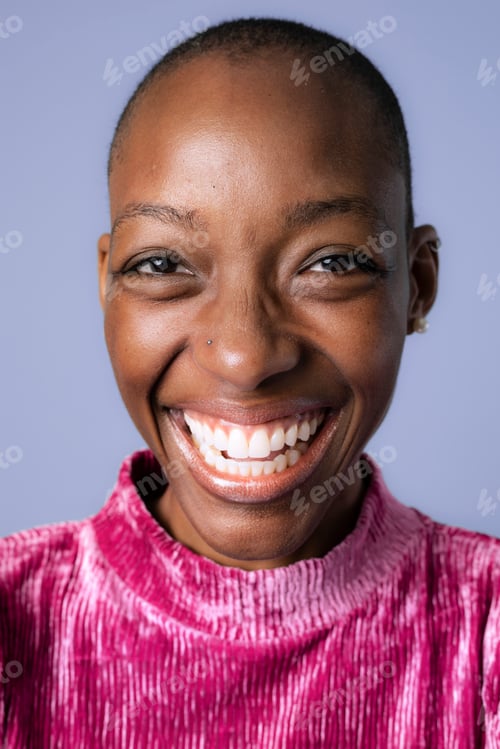 Preview: Happy black woman in a pink dress