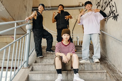 Preview: Group of Friends Relaxing on Staircase Outdoors