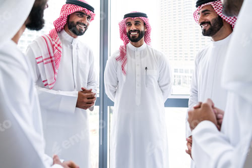 Preview: Arab businessmen wearing emirati and saudi kandura meeting in the office