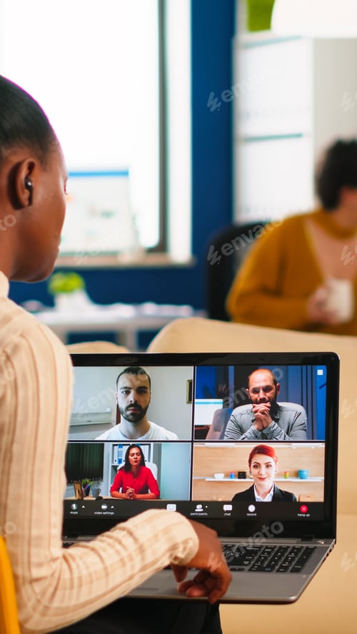 Preview: African manager woman discussing with remote colleagues using video call