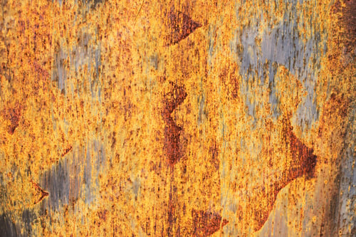 Preview: Orande rusty abstract painted metal background. texture of old plate with brown rust
