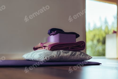 Preview: Mat and equipment on the floor ready for yoga. Copy space