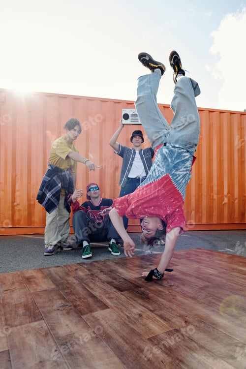 Preview: Breakdancing Outdoors by Group of Teenagers on Bright Day