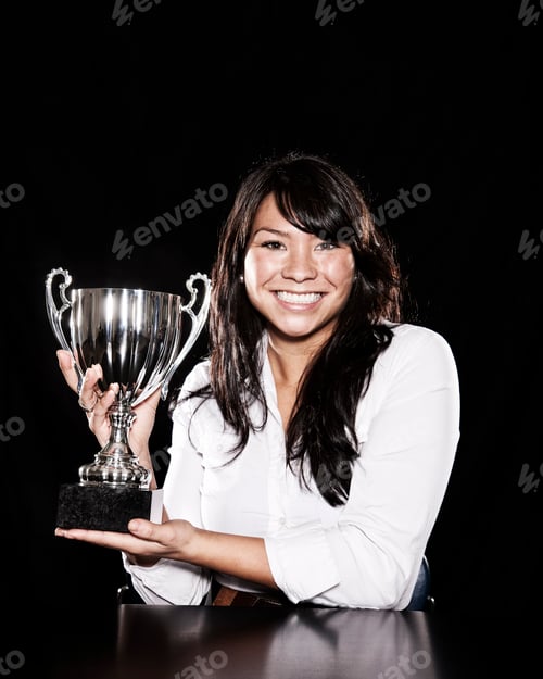 Preview: Studio portraits of an Asian woman holding a trophy.