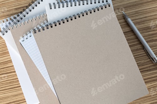 Preview: Color pencil and sketchbook on a table