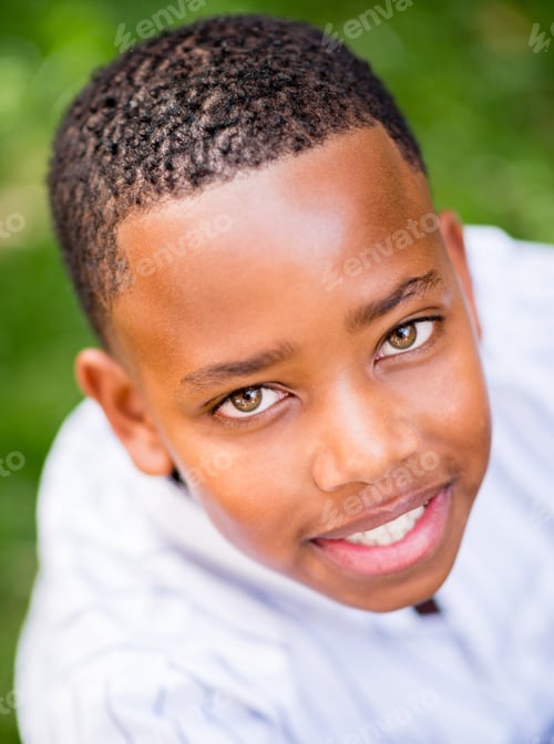 Preview: Beautiful Portrait Of An African American Boy Smiling Outdoors