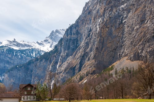Preview: Horizontal shot of а wooden house at the foot of the mountain, Bern, Swiss Alps, Switzer