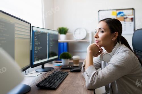 Preview: Programmer checking the code for an app