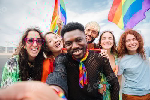 Preview: Happy multiracial young adult people having fun celebrating gay pride event. Group of diverse